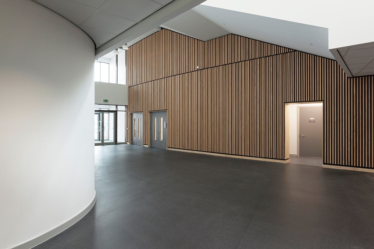 Image of XpressLay in a grey shade in a school corridor