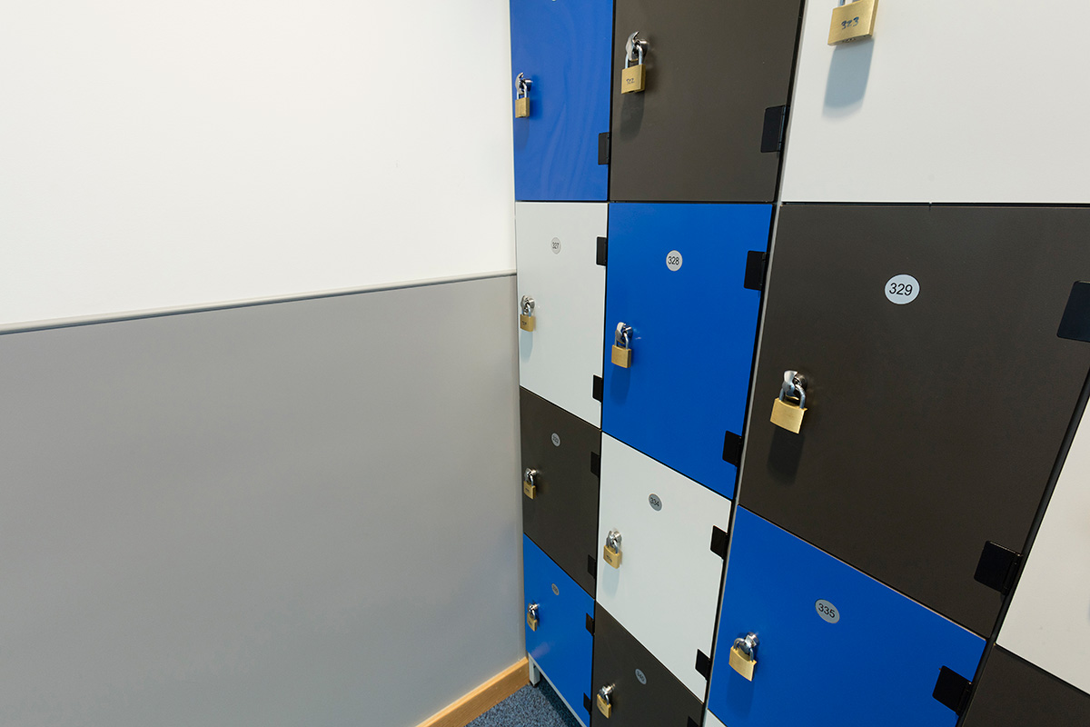 A grey shade of Altro Fortis Titanium installed in a school locker area.